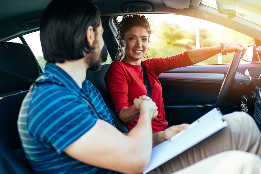 Driving School Insurance - Teenager Getting Her Driving Test Done with a Driving School